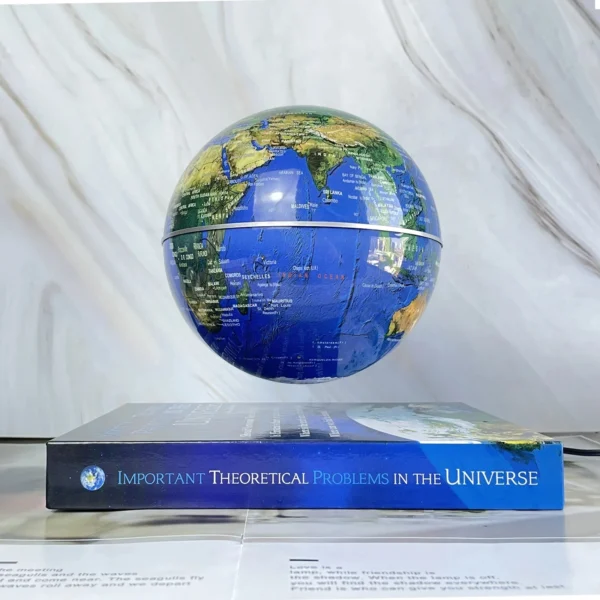 Floating Globe Magnetic Levitation Globe Educational Supplies Luminous Earth Globe Cosmic Cover Book Base 3 A blue globe levitates above a book titled "Important Theoretical Problems in the Universe" against a marble backdrop."