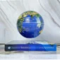 A blue globe levitates above a book titled "Important Theoretical Problems in the Universe" against a marble backdrop."