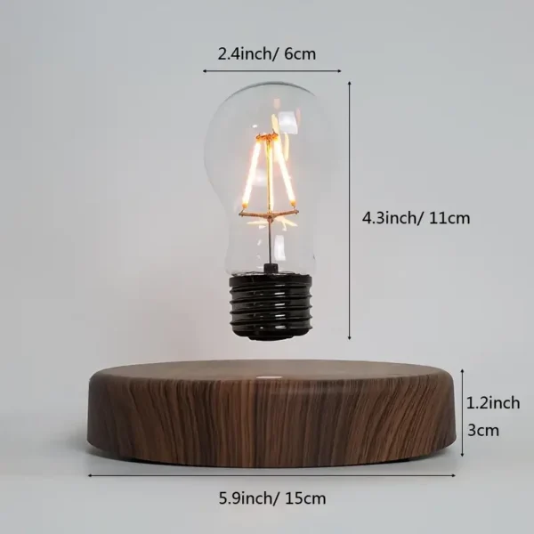 floating light bulb.webp A floating light bulb above a wooden base with measurements: 2.4 inches (6 cm) in width, 4.3 inches (11 cm) in height for the bulb, and 5.9 inches (15 cm) in width, 1.2 inches (3 cm) in height for the base.