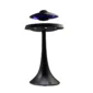 A black, UFO-shaped levitating speaker floats above its base, with blue LED lights glowing from the underside.