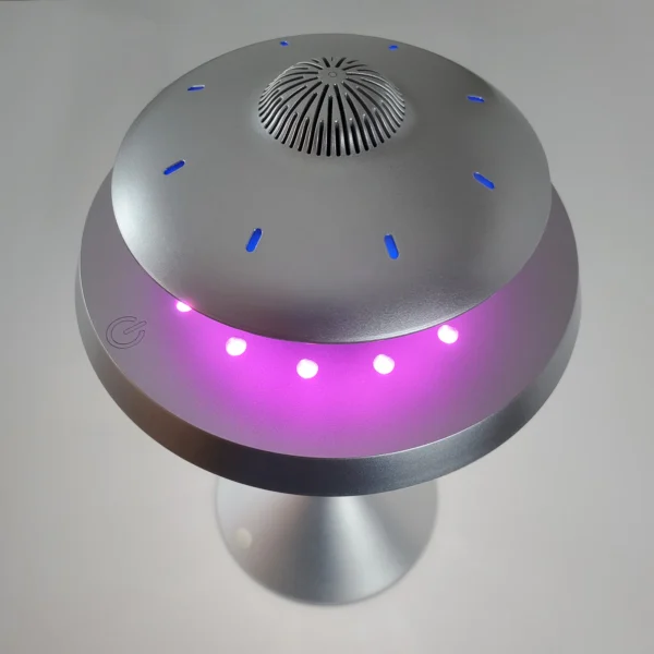 UFO Speaker Super Cool Levitating Speaker Magnetic Floating UFO Speaker Music Player with RGB Color Table Lamp 3 A sleek, silver UFO-shaped device with blue and purple lights, possibly a lamp or air purifier, on a white background.