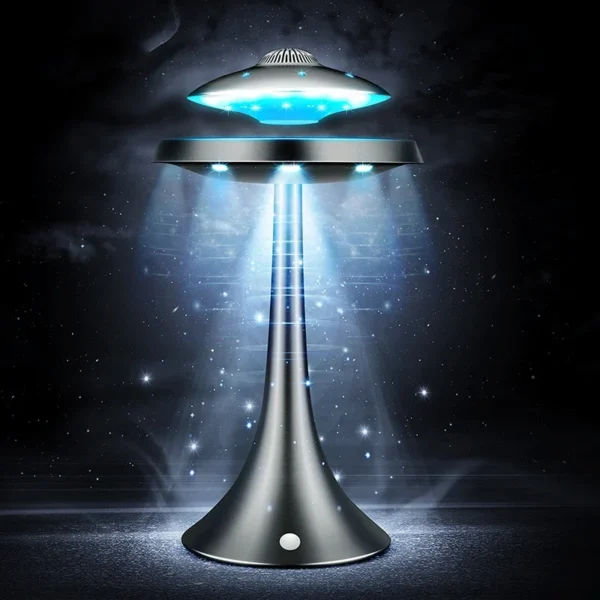 UFO Speaker Super Cool Levitating Speaker Magnetic Floating UFO Speaker Music Player with RGB Color Table Lamp 4 A sleek, futuristic UFO-shaped lamp emits blue LED lights from the top and sides, creating a glowing effect in a dark space.
