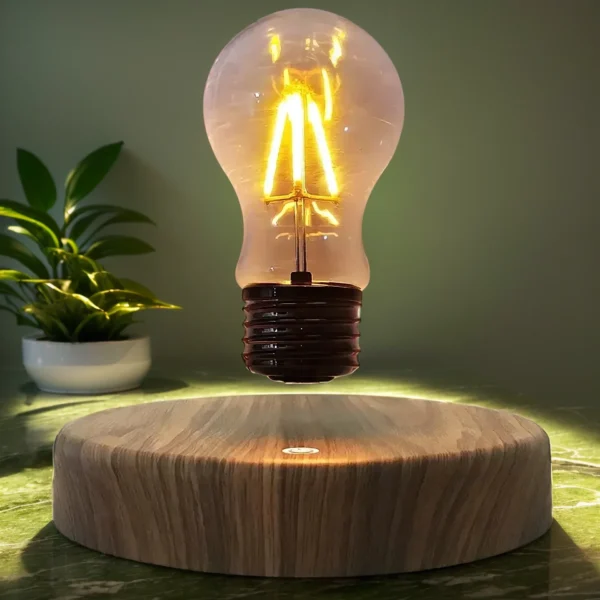Floating Light Bulb 10 A levitating light bulb with visible filaments glows above a wooden base. A plant is in the background.
