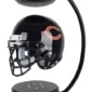 A black football helmet with a "C" logo levitates between a magnetic base and top.