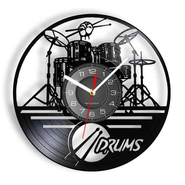 A wall clock with a cut-out vinyl record design featuring a drum kit silhouette and the word "Drums" below.