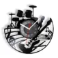 A decorative wall clock features musical instruments and notes, including a drum set, guitar, saxophone, and microphone, with a central analog clock displaying the time.