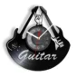Wall clock designed with guitar shapes and a vinyl record theme, featuring a raised hand symbol at the top.