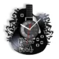 Wall clock designed as a guitar with musical note motifs and the phrase "Music is the voice of the soul" on the face.