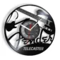 Wall clock with guitar silhouettes and the words "Fender" and "Telecaster" on a black vinyl record background.