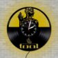 Skeletal Brain Wall Clock crafted from a vinyl record features an artistic design of a human figure and the word "tool" on a brick wall.