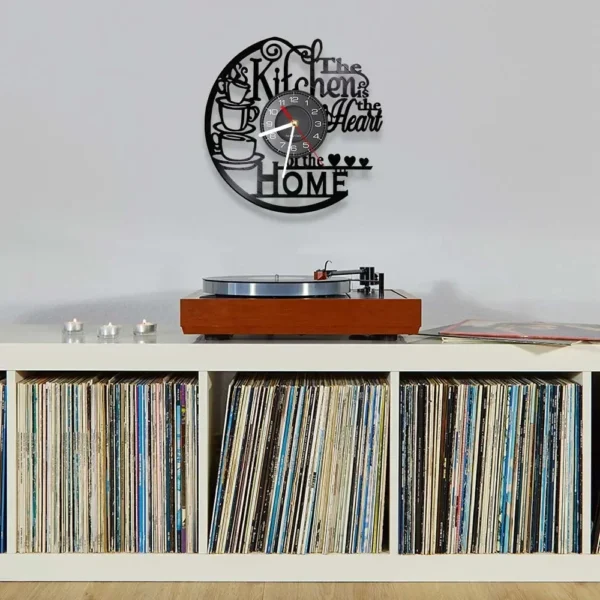 The Kitchen The Heart of The Home Inspired Vinyl Record Clock Modern Design Vinyl Wall Watch Kitchen Decor Noiseless Timepieces 6 Wall decor with a kitchen-themed clock above a record player on a vinyl-filled shelf.