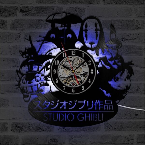 Totoro Studio Ghibli Clock 3 Wall clock featuring silhouettes of Studio Ghibli characters and logo, set against a brick wall backdrop.