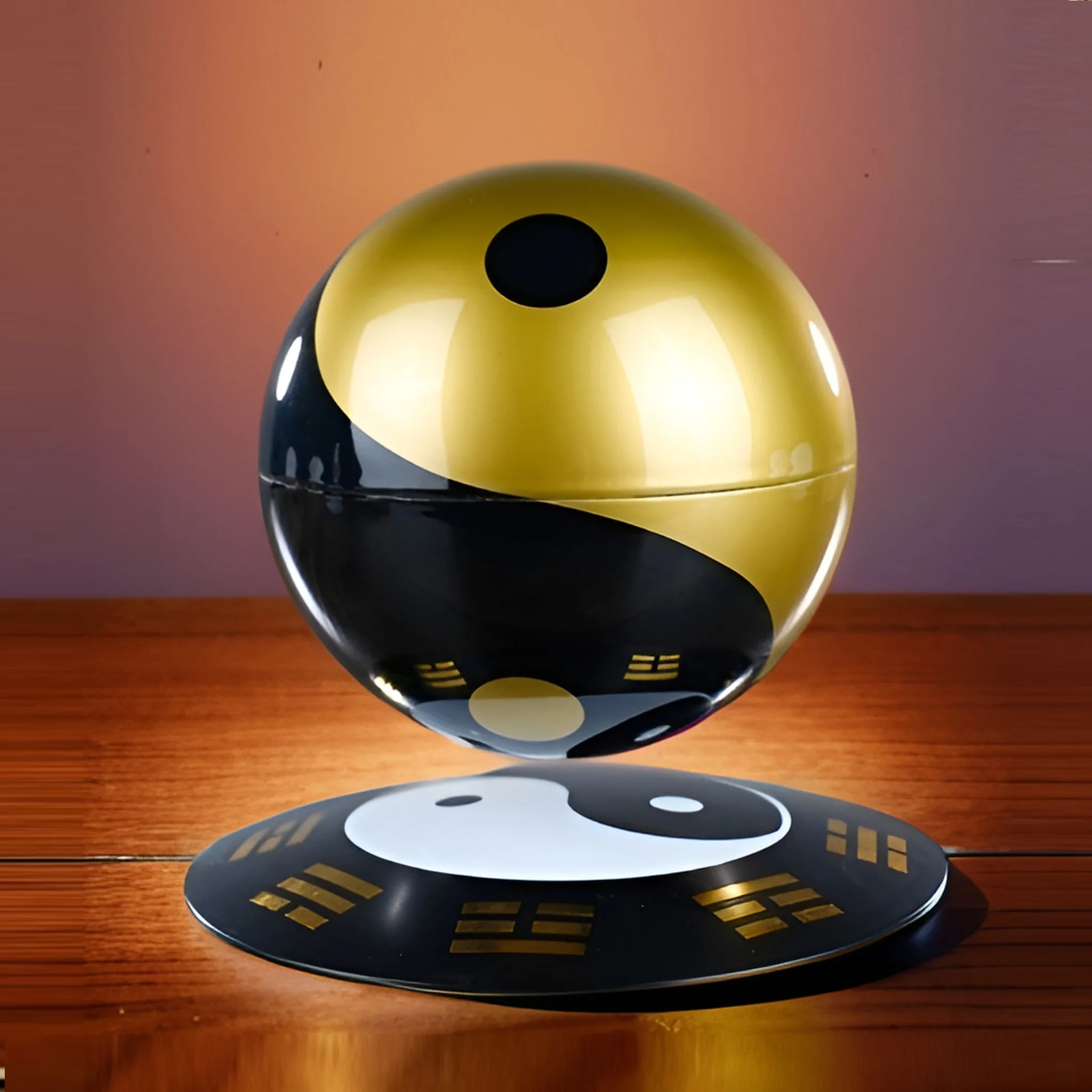 The Levitating Magic Ball, featuring a glossy gold and black yin-yang design, sits suspended above a wooden surface with a coordinated yin-yang disk beneath it.