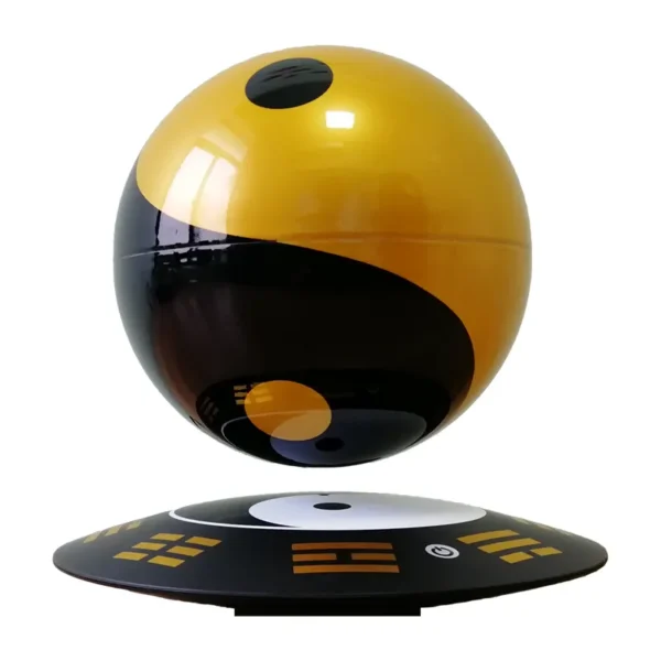 HCNT Feng Shui ornaments Yin and Yang Tai Chi ball home decoration levitation ball 4 A black and yellow yin-yang-themed sphere levitates above a matching base with digital symbols.