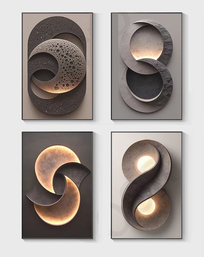 The Lunar Orbit Wall Light features four abstract pieces with circular and infinity loop designs, showcasing textured surfaces and subtle lighting effects.