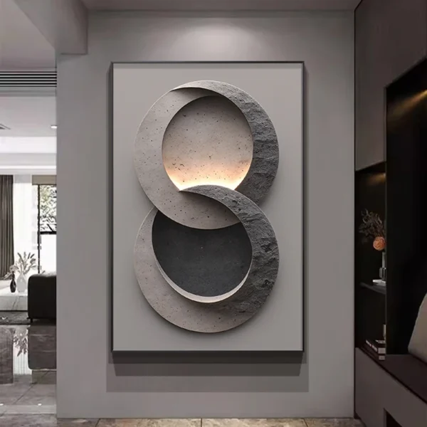 Modern Luxury LED Wall Lamp With Simple Texture Style Foyer Living Room Decoration Luminous Corridor Hanging Mural Lights 2 A modern, abstract wall art piece with interlocking circular shapes in gray tones, illuminated by soft lighting, hanging in an elegant interior.