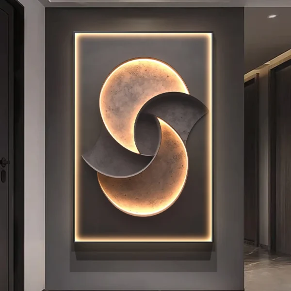 A modern wall art piece featuring abstract, interlocking shapes with illuminated edges, creating a circular pattern.