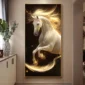 A framed painting of a glowing white horse with flowing mane and tail, set against a dark background, is displayed on a wall in a room with a plant and a cabinet nearby.