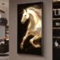 A framed painting of a luminous white horse in motion is displayed on a wall in a dimly lit room.