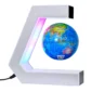 A small globe floats in midair within a C-shaped white frame that is illuminated with multicolored LED lights; a power cord is attached to the frame.